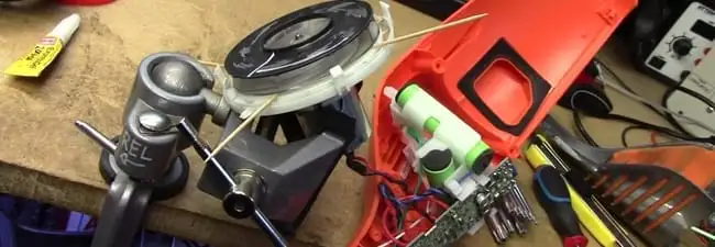 Vacuum cleaner repair parts and tools on a workbench in Long Beach, CA
